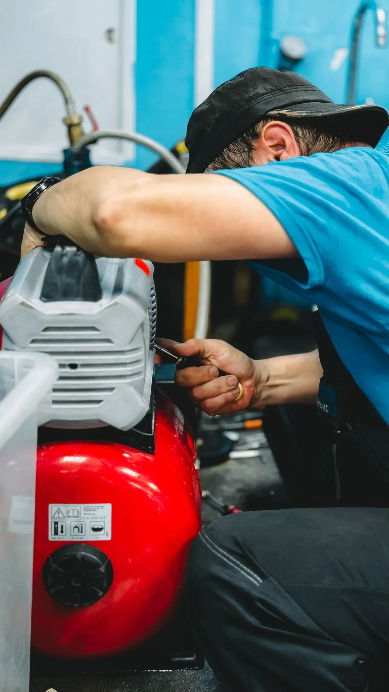 Technician performing scheduled compressor maintenance