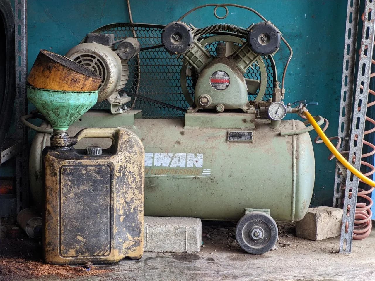 Industrial air compressor maintenance in a workshop